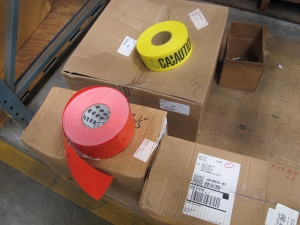 (2 PALLETS) BARRIER TAPE, (8 ROLLS) "CAUTION", (7 BOXES) "DO NOT ENTER" , (1 BOX) "AUTHORIZED PERSONNEL ONLY". LOADING & HANDLING FEE $15-4222